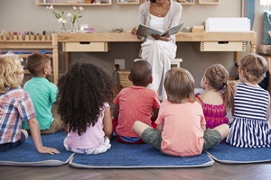 Children in daycare center listening to a story